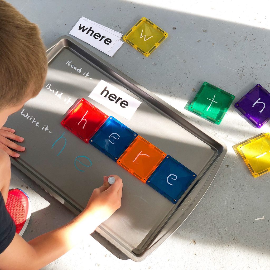 Connetix Magnetic Tiles literacy game played on oven sheet baking tray